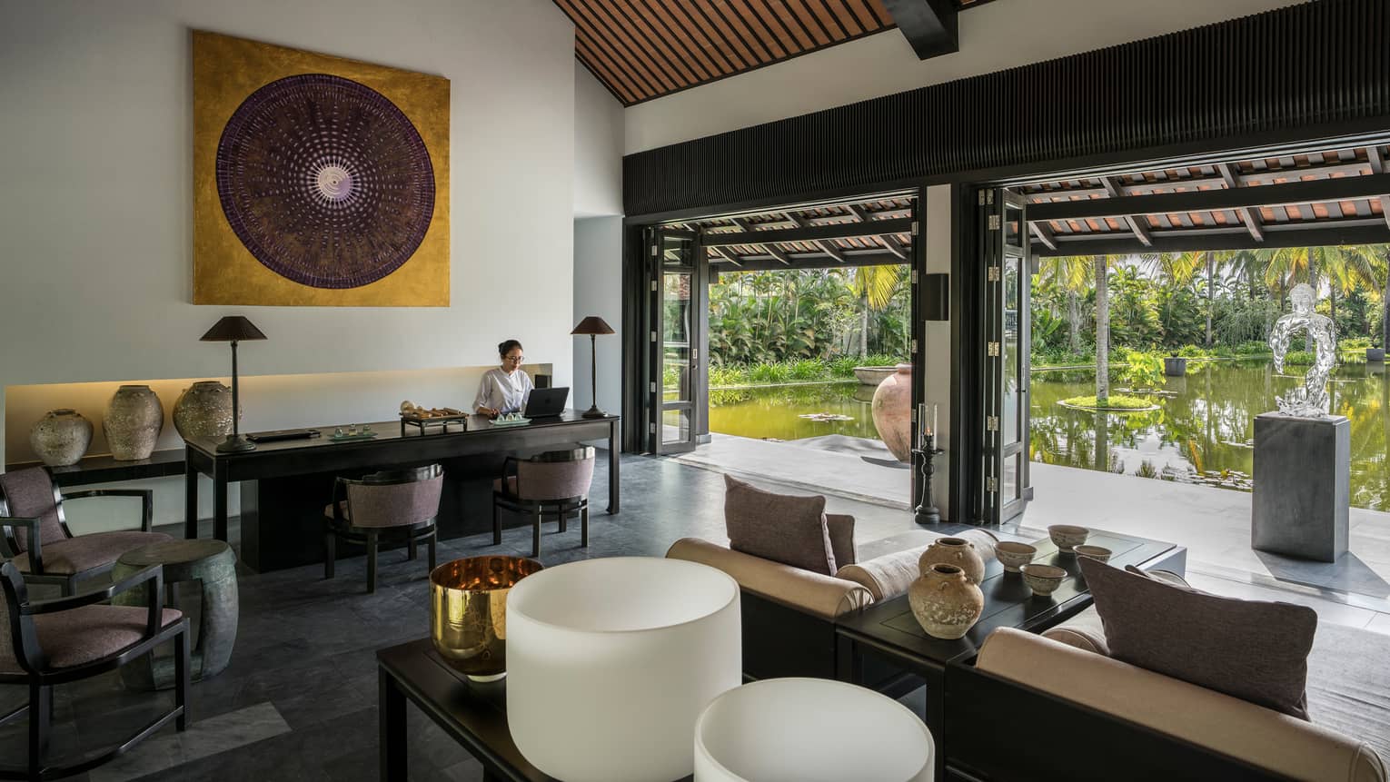 Tranquil spa reception overlooking lotus pond at Four Seasons Resort The Nam Hai, Hoi An.