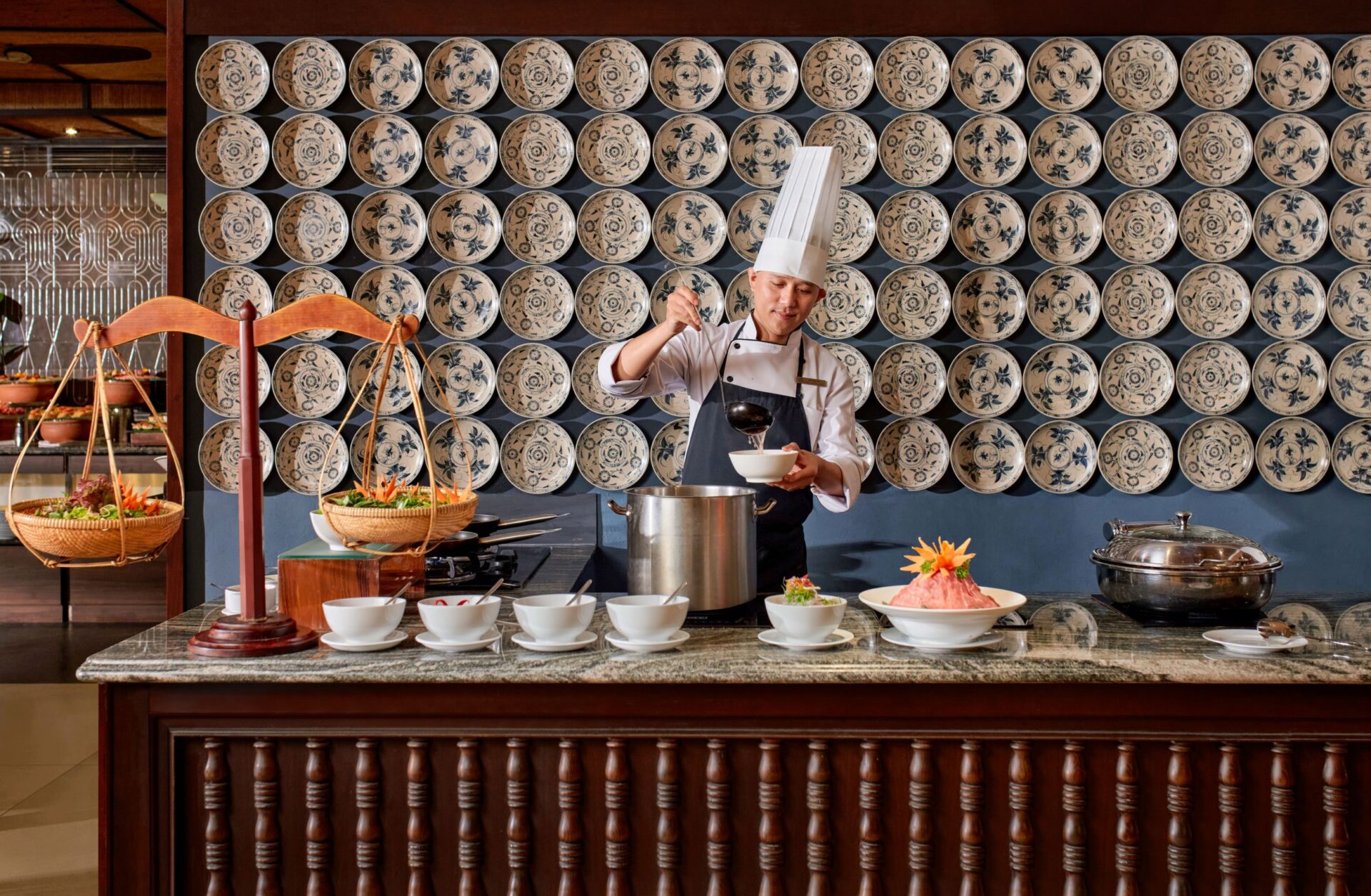 Chef preparing signature cuisine at La Siesta Hoi An Resort