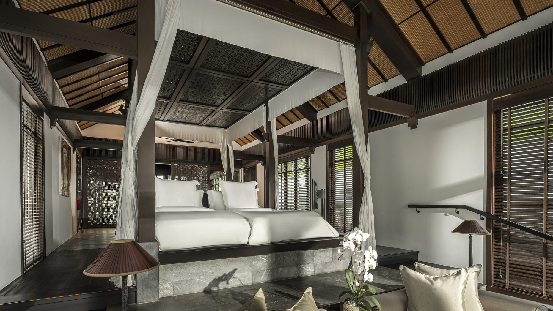 Luxurious villa interior with four-poster bed at Four Seasons Resort The Nam Hai, Hoi An.