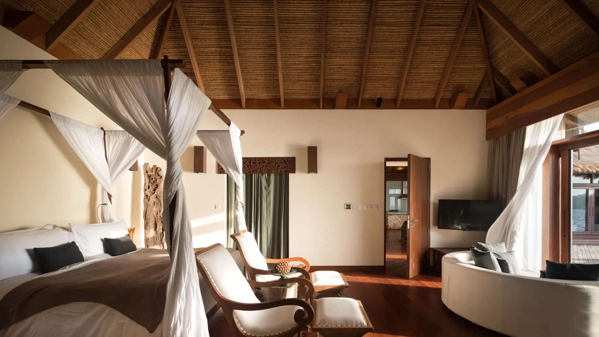 Eco-luxury interior design inside a private villa at Song Saa Private Island with natural wood and open living space