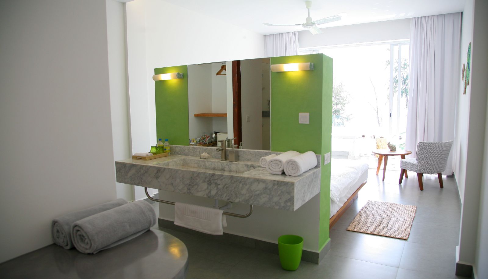 Minimalist guest room at Naia Resort Sihanoukville with clean design, natural light, and contemporary comfort