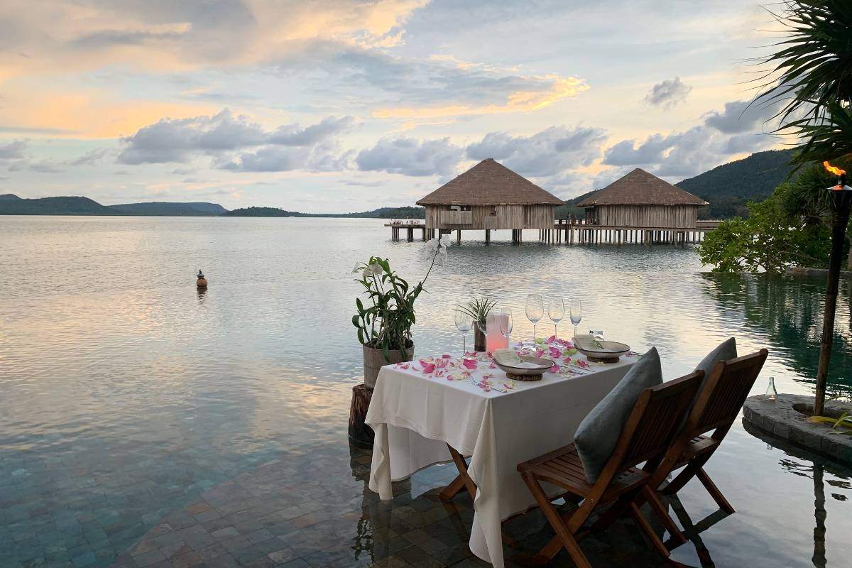 Romantic private dining by the sea at Song Saa Private Island, capturing the serene atmosphere and unforgettable luxury island experience in Cambodia