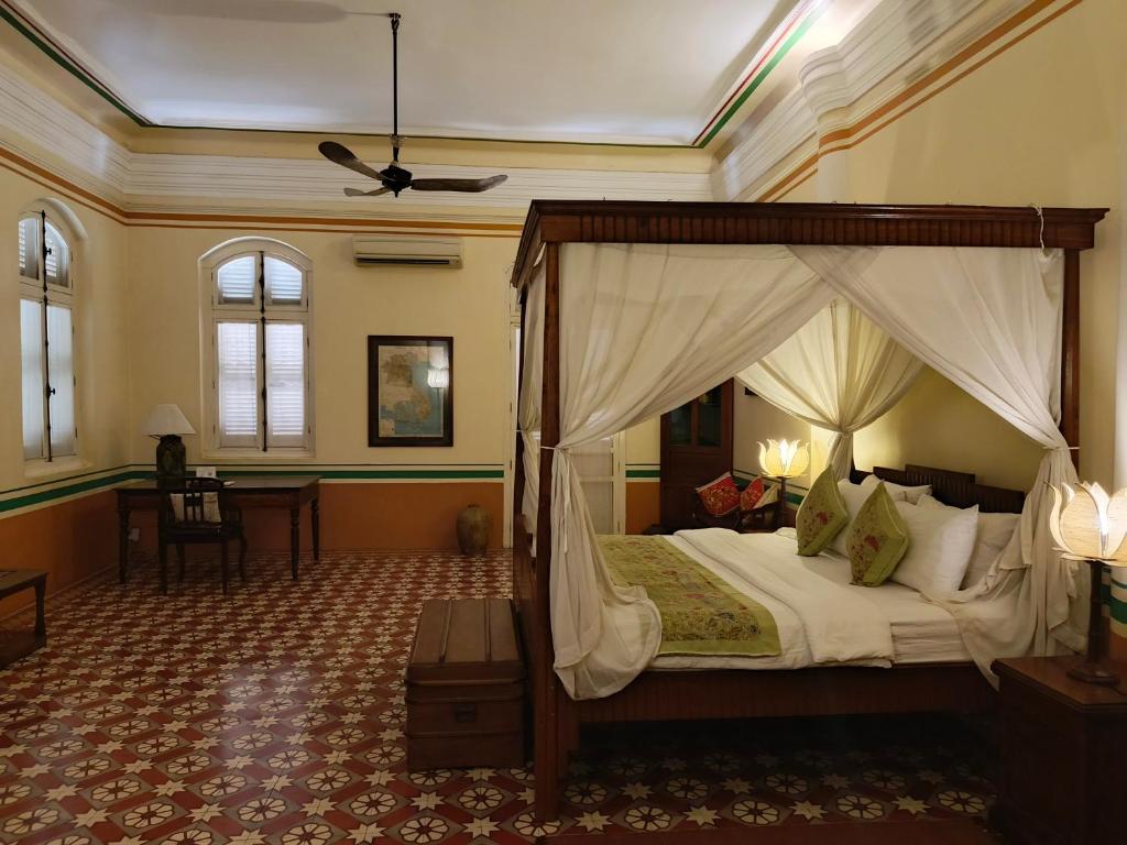 The spacious and well-equipped Superior Double Room at La Villa Battambang is fully furnished.