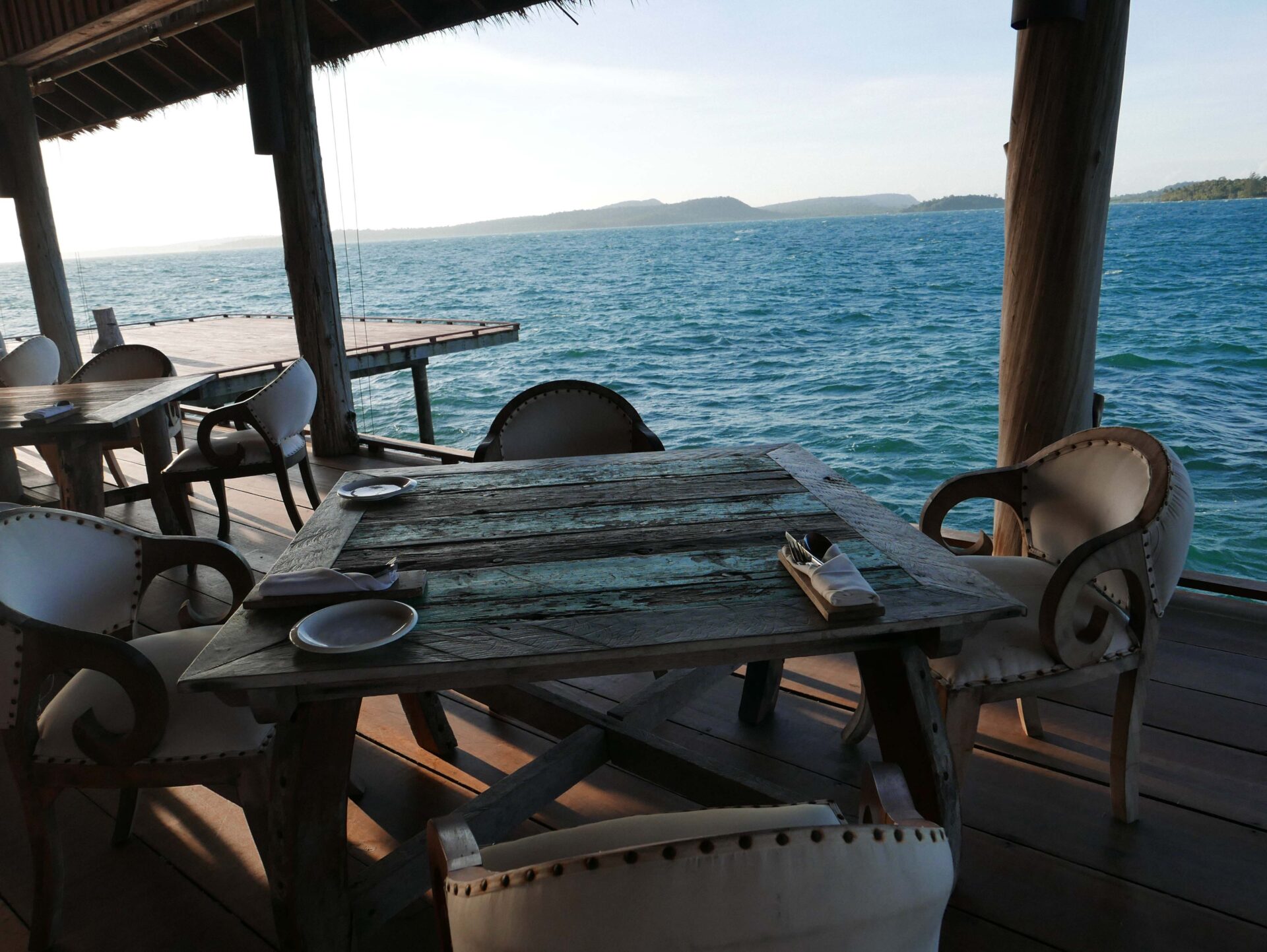 Private seaside dining experience at Song Saa Private Island overlooking the calm ocean
