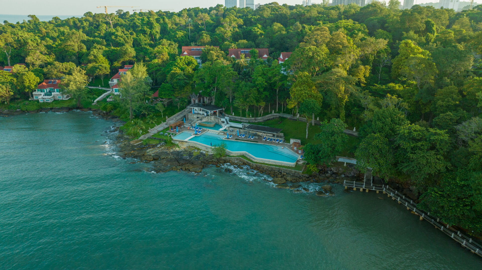 Private beach area at Independence Hotel by Dara with sun loungers and shaded seating