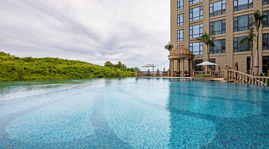 Aerial view of the central swimming pool at Jin Bei Palace Hotel featuring modern geometric design and courtyard layout