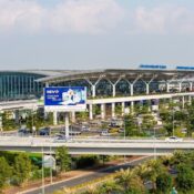 Noi Bai International Airport Vietnam terminal exterior with modern architecture and surrounding transport infrastructure