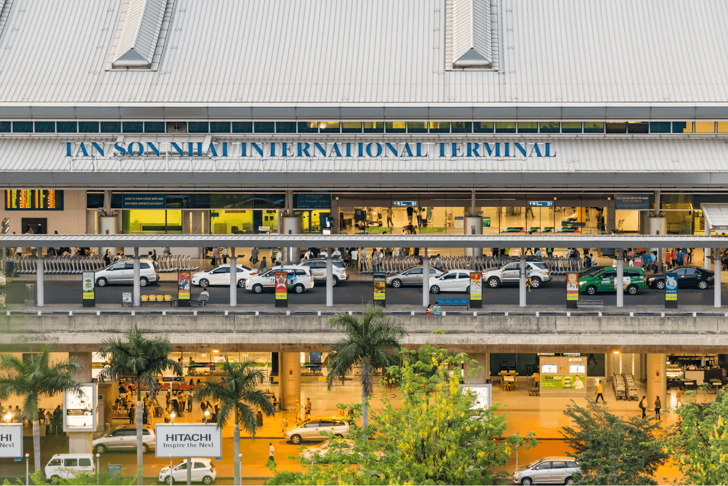 Tan Son Nhat International Airport Vietnam terminal exterior with busy traffic, passenger drop-off area, and modern airport facilities