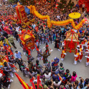Vietnam Festivals with vibrant dragon dance and large crowd celebrating traditional cultural parade