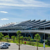 Exterior view of Hue Airport Vietnam (Phu Bai Airport) with illuminated terminal and runway access road