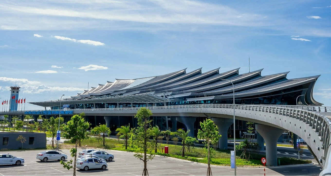 Exterior view of Hue Airport Vietnam (Phu Bai Airport) with illuminated terminal and runway access road