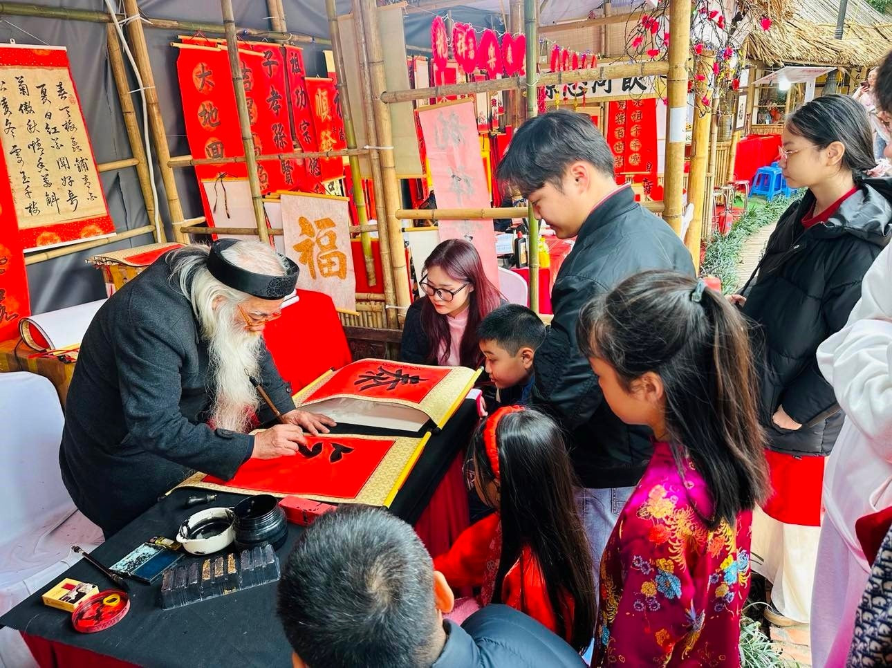 Requesting calligraphy at the Spring Calligraphy Festival has become an annual event at the Temple of Literature Hanoi.