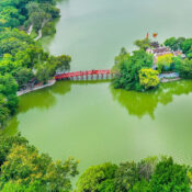 Ngoc Son Temple, viewed from above, with its ancient architecture nestled amidst the serene Hoan Kiem Lake.